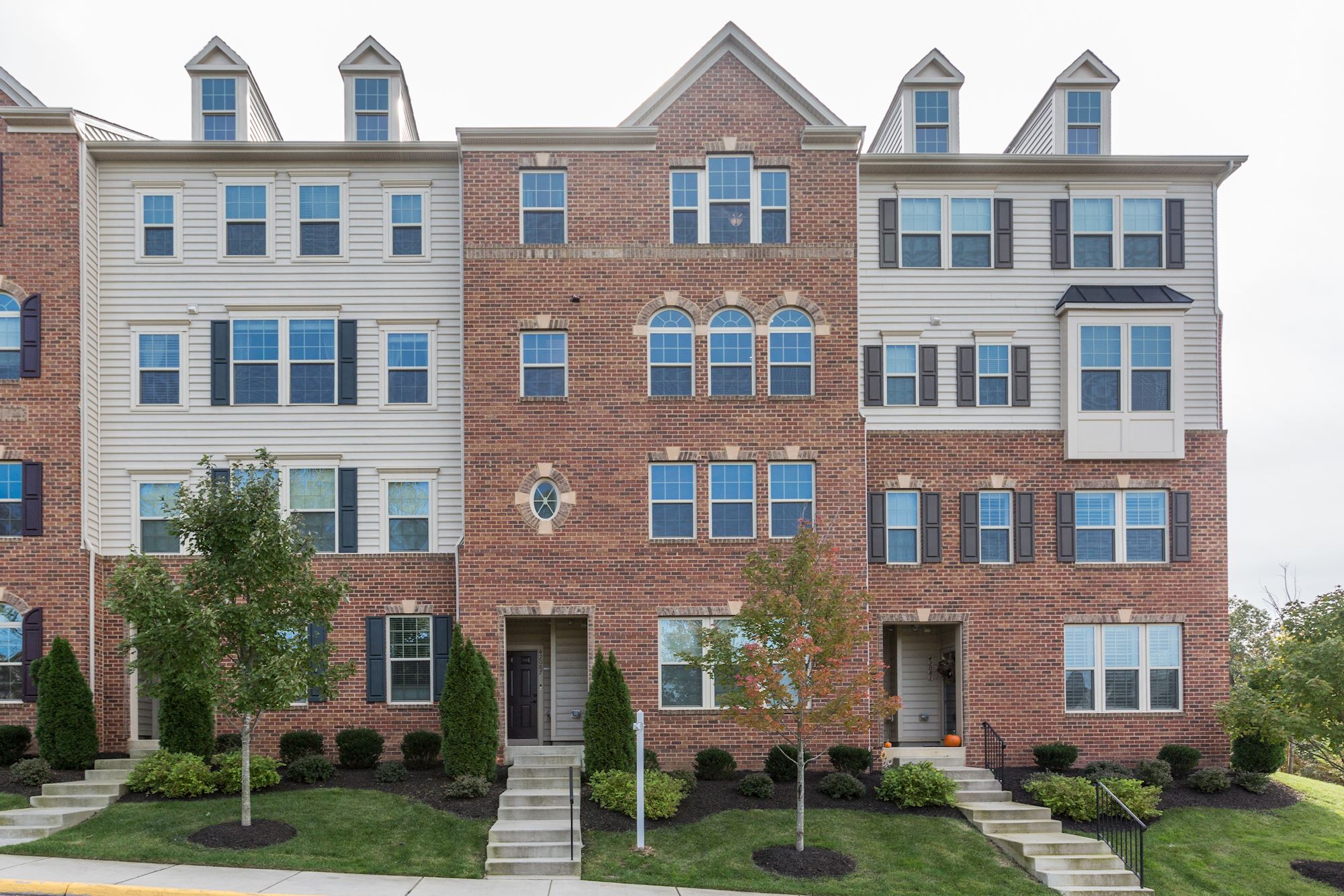 Image showcasing NEW LISTING: 3 BD Upgraded Townhouse-Style Condo